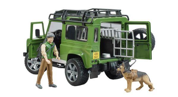 Image de Land Rover Defender Station Wagon avec forestier et chien